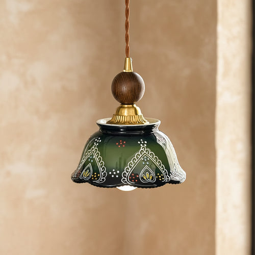 Glazed ceramic dome pendant light with dark green base and gold decorative trim