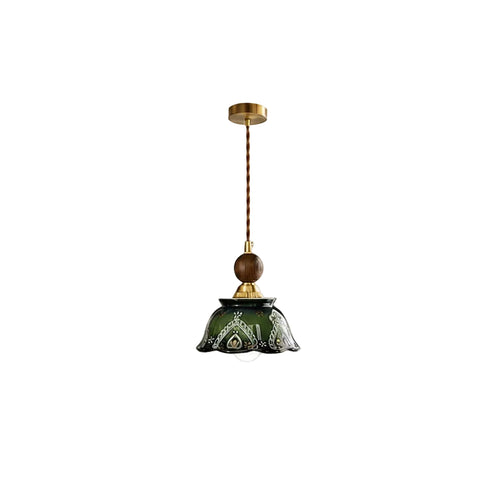 Ceramic dome pendant light with dark green shade, gold ceiling cap, and hanging cord