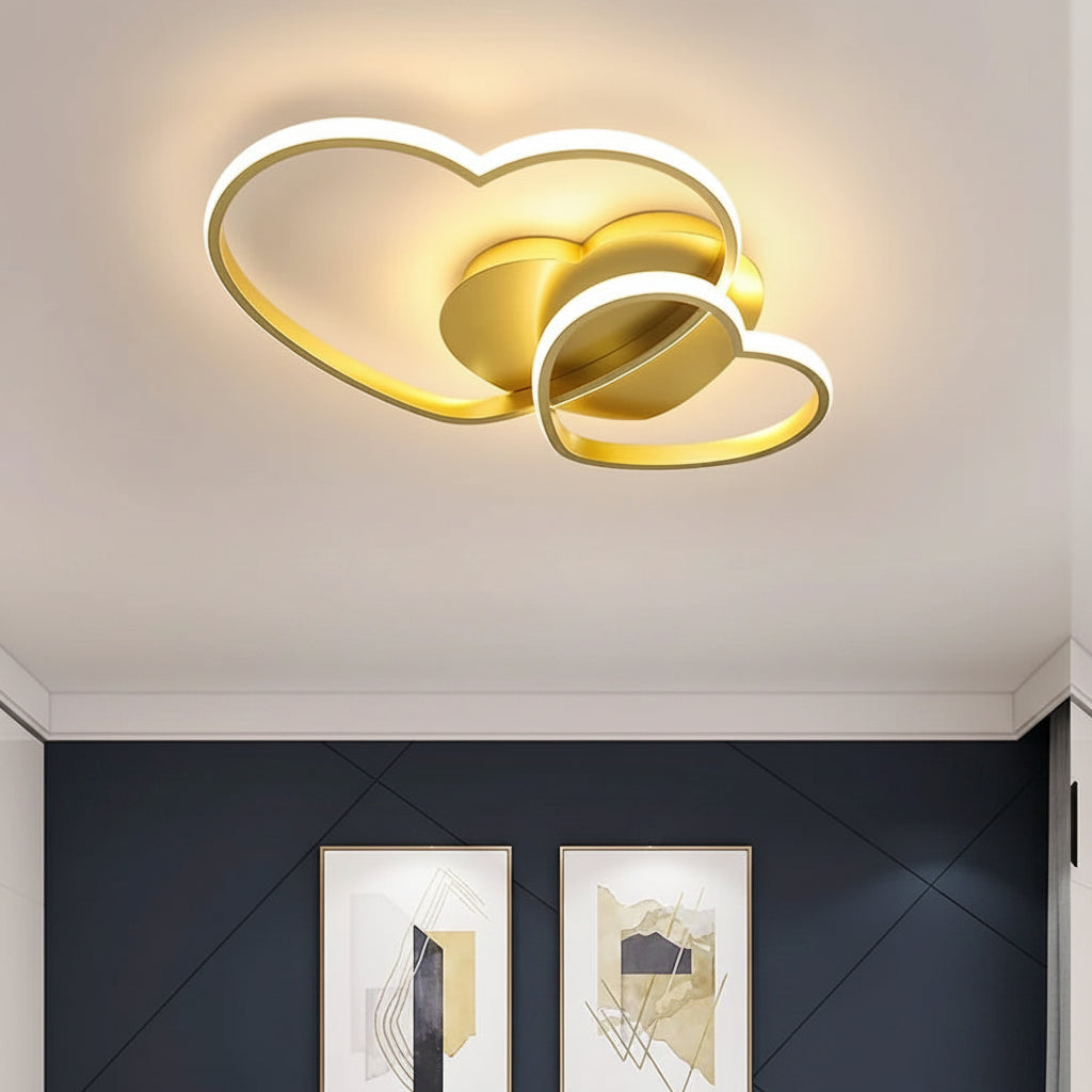 Double-heart LED flush mount ceiling light with gold accents and bright white halo glow