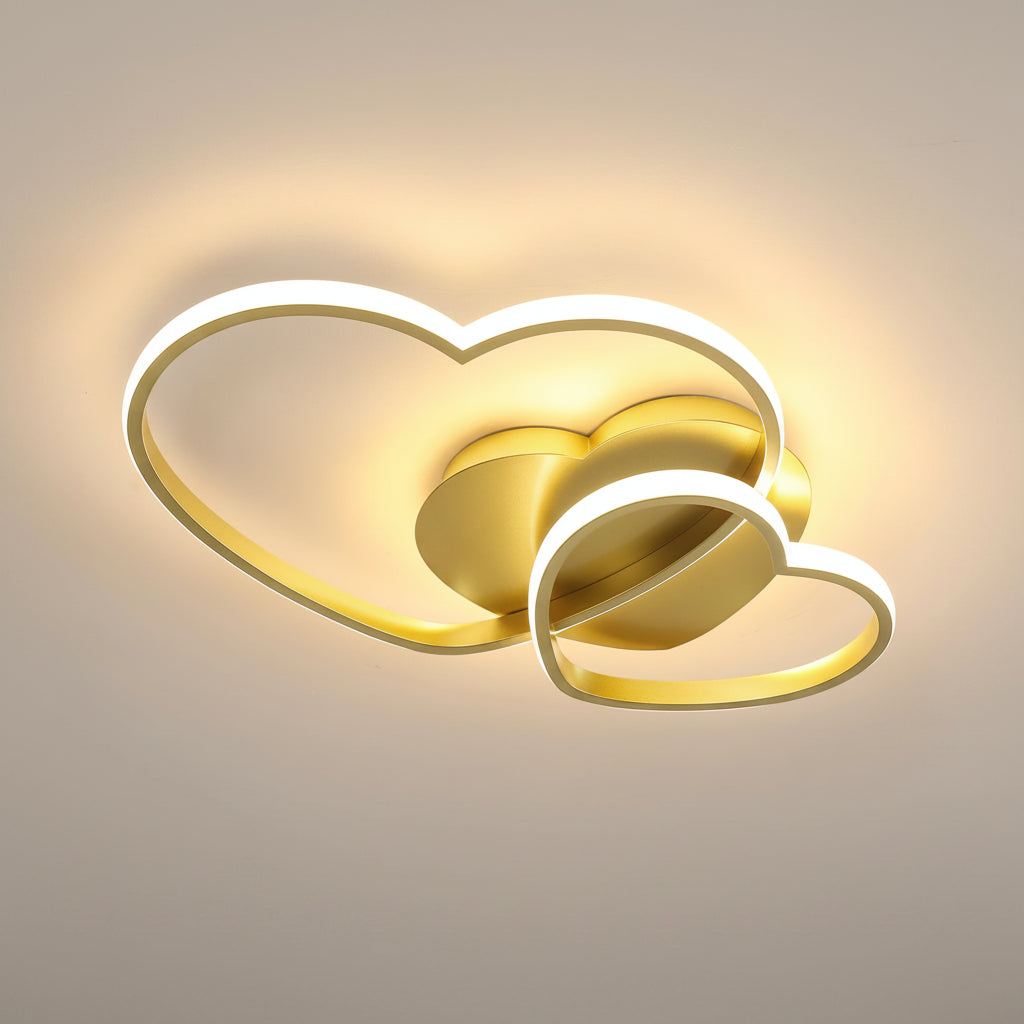 Double-heart LED flush mount ceiling light in gold with warm white perimeter halo glow