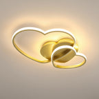 Double-heart LED flush mount ceiling light in gold with warm white perimeter halo glow