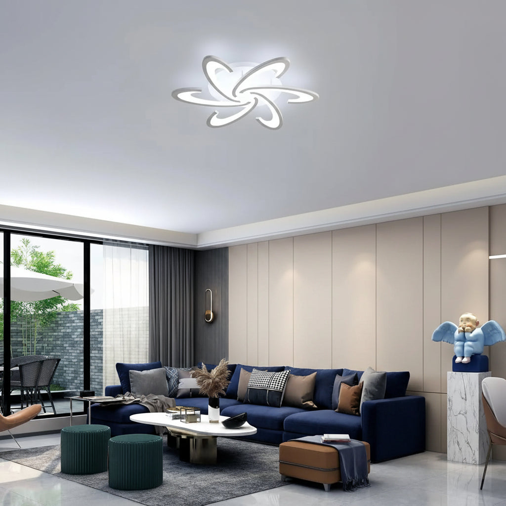 White acrylic spiral petal LED flush mount ceiling light above a modern sofa