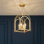 Gold open-frame cage pendant light with four lit bulbs and chain-hung canopy