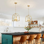 Set of two gold open-frame cage pendant lights with four bulbs each, chain-hung