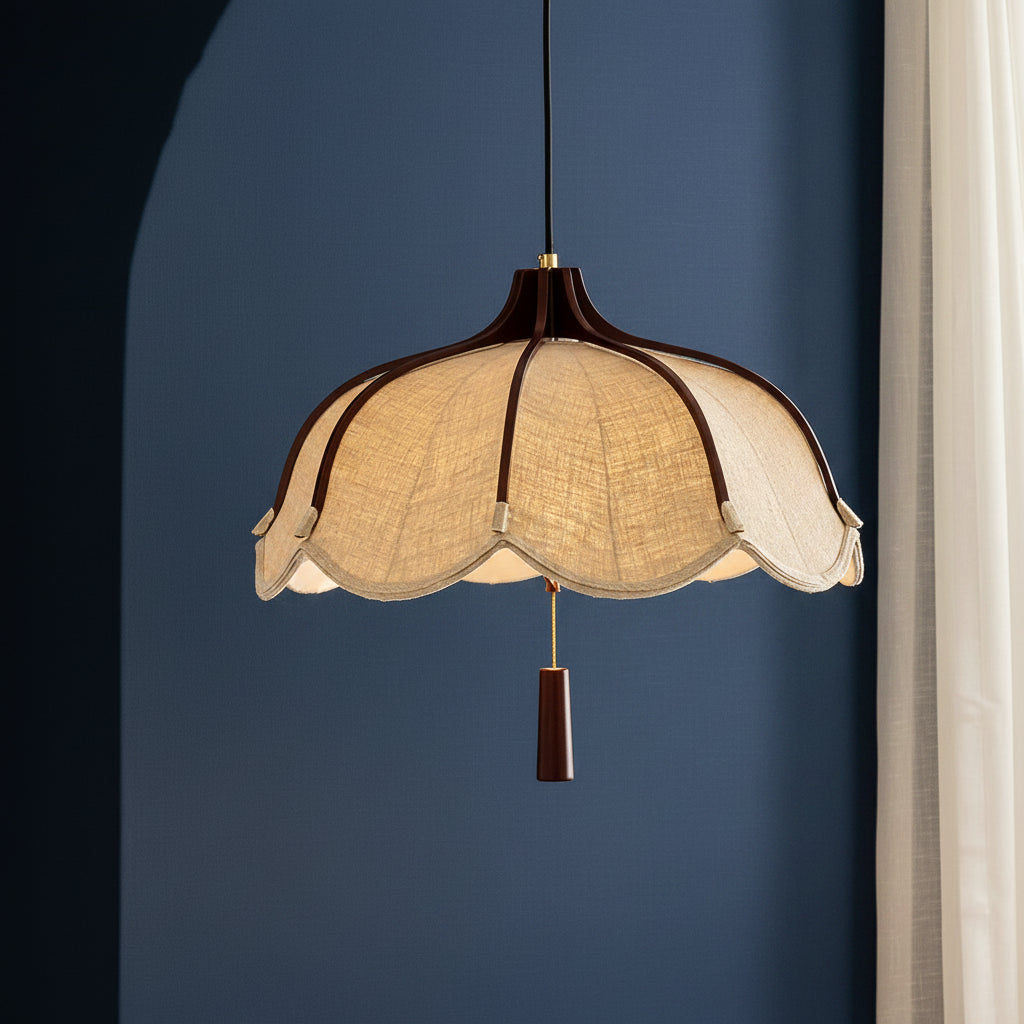 Scalloped beige fabric pendant lamp with dark brown top ring and hanging cylinder
