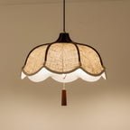Beige scalloped fabric pendant light with warm diffuser and brown hanging finial