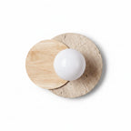 Layered circular wall sconce with white globe, light wood and travertine discs