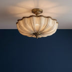 Antique bronze scalloped round ceiling light with pleated fabric shade