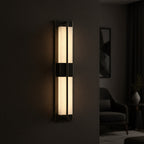 Black vertical wall light sconce with frosted glass strip panels in a long rectangular frame