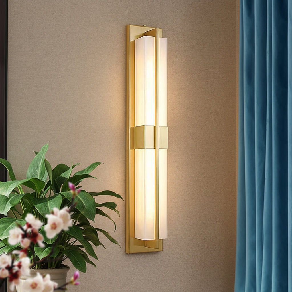 Gold vertical wall light sconce with frosted glass strip panels, framed in a long rectangle