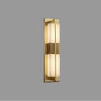 Gold vertical wall light sconce with frosted glass strip panels in a long metal frame
