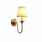 Brass single-arm wall sconce with conical shade and U-shaped gooseneck support