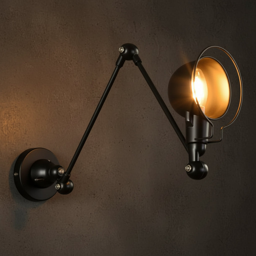 Black dome swing-arm wall sconce with warm lit bulb and round wall plate