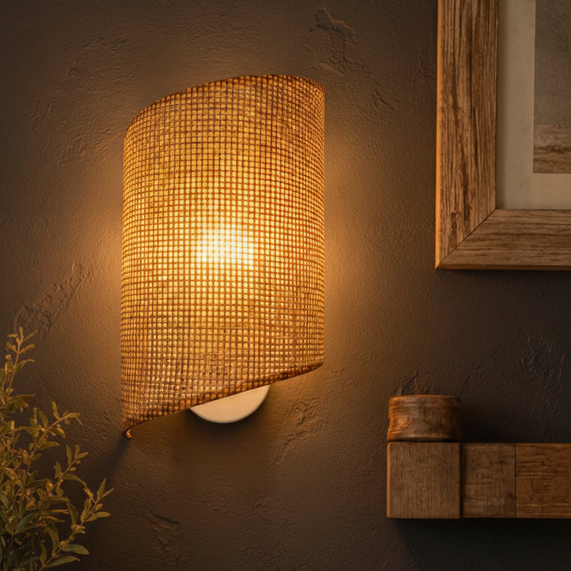 Bamboo curved cylinder wall sconce with grid-weave shade, warm light glow