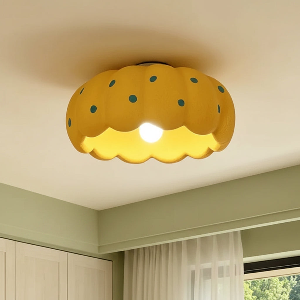Scalloped yellow pumpkin-style ceiling light with teal dot pattern