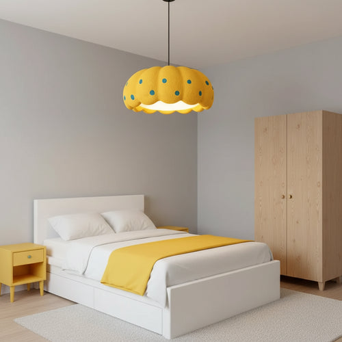 Yellow pumpkin-style pendant light with scalloped fabric shade and blue dot pattern
