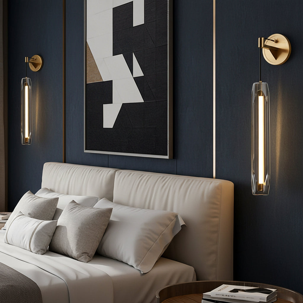Brass backplate tubular glass wall sconce with vertical clear glass cylinder