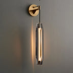 Brass round wall mount tubular glass sconce with clear vertical glass tube