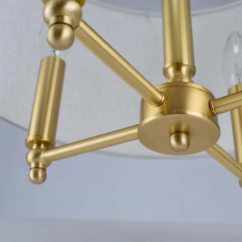 Gold multi-arm pendant light fixture with candle-style sockets and central canopy
