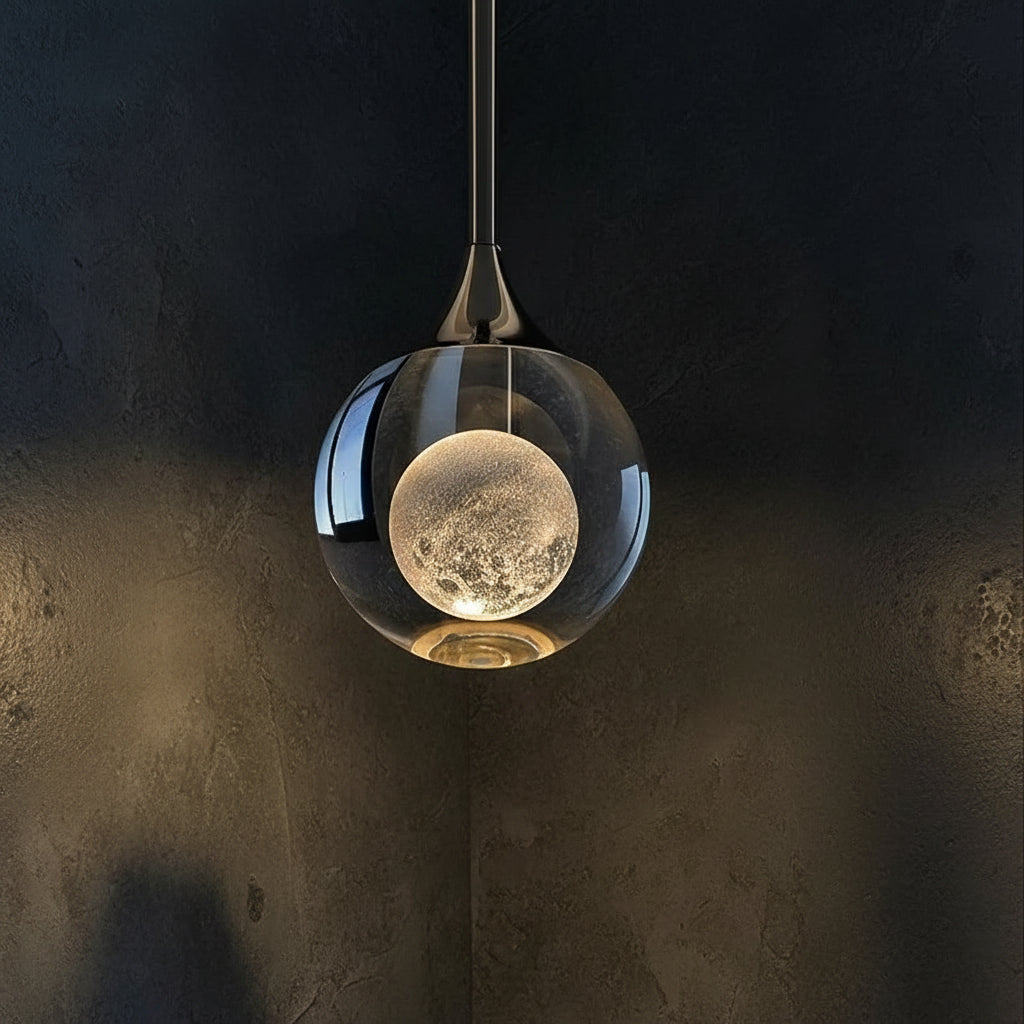 Teardrop pendant light with smoked glass shade and moonlike globe inside, dark metal mount