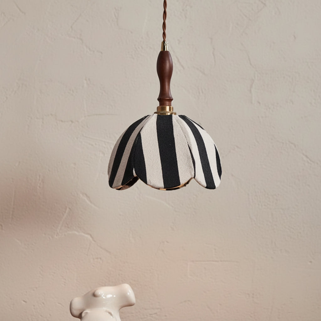 Striped fabric pendant light shade, black and white scalloped edge with brown cord.