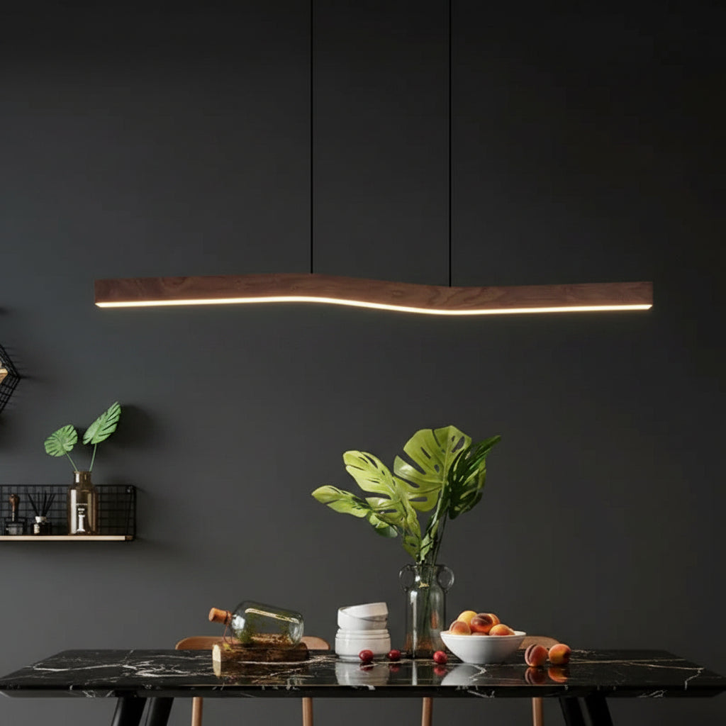 Curved wooden linear pendant light with warm illuminated strip, hanging from two cords