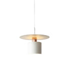 Single white cylindrical pendant light with a warm glowing bulb