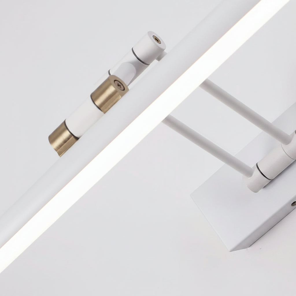 White tubular LED wall sconce close-up with adjustable joints and brass connector ends