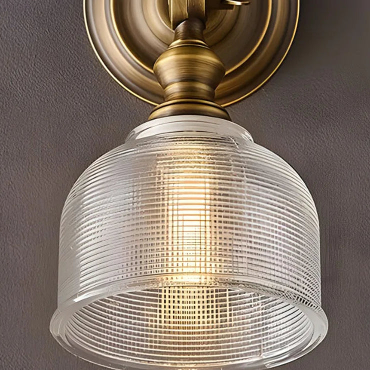 Ravi vintage glass dome wall light close-up, ribbed clear dome with antique brass mount