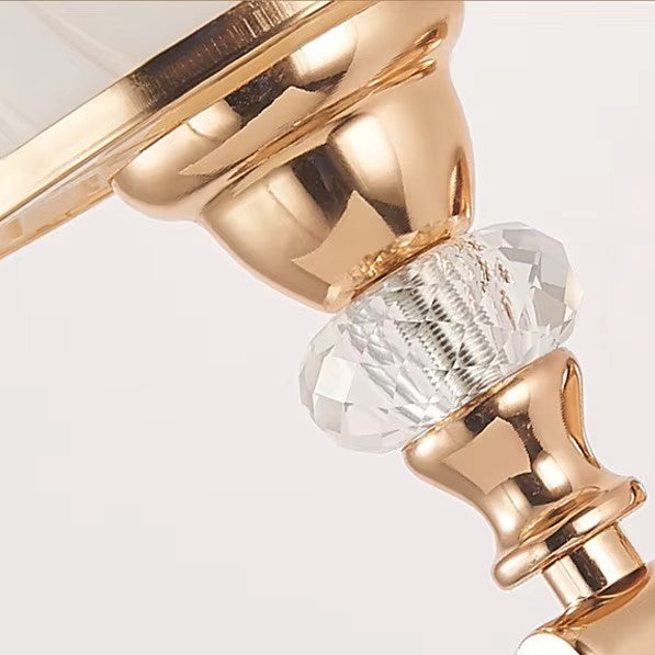 Gold sconce fittings with faceted crystal teardrop and beaded pull chain