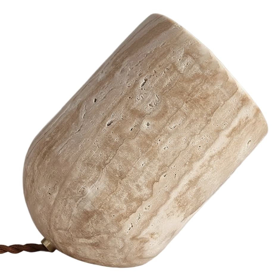 Travertine table lamp with slanted cylindrical shade, beige stone texture and braided cord