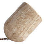 Travertine table lamp with slanted cylindrical shade, beige stone texture and braided cord