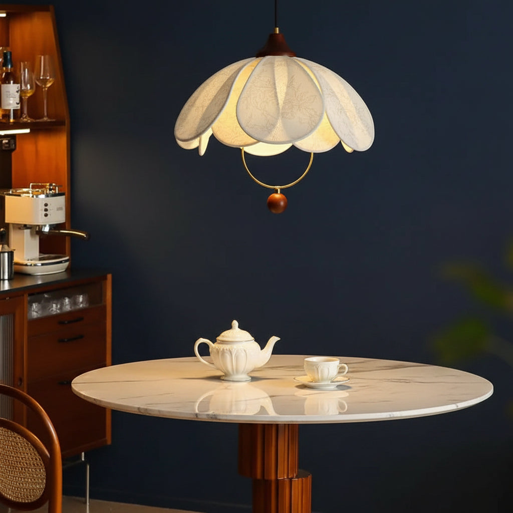 Fabric petal pendant light with layered cream shade, gold ring, and brown hanging detail