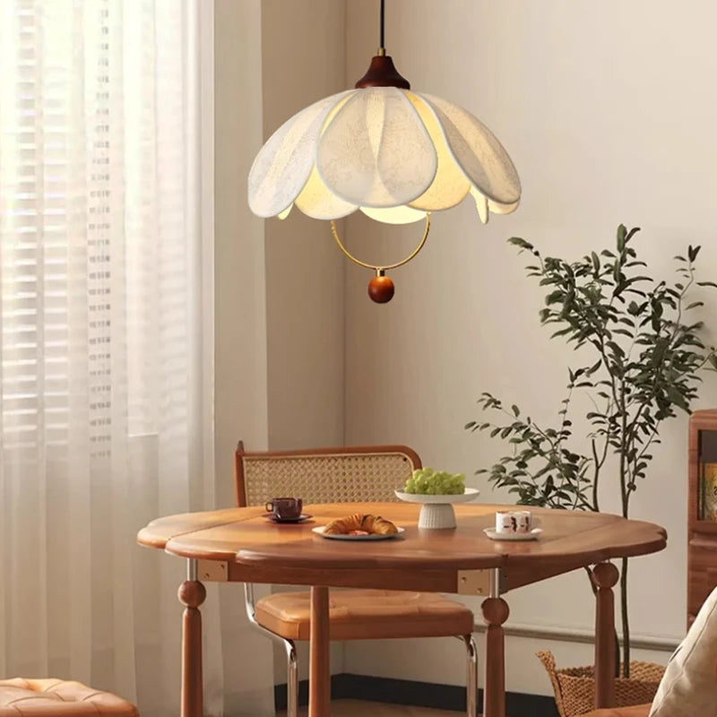 Layered fabric petal pendant light with cream shade and brown hanging finial