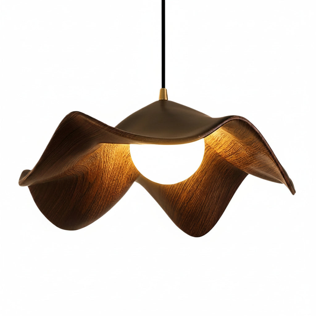 Curved wooden pendant light with warm glowing bulb and dark cord on white background