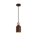 Isolated stacked pendant light with black canopy, beige stone sphere, and brown cylindrical shade
