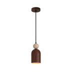 Isolated stacked pendant light with black canopy, beige stone sphere, and brown cylindrical shade
