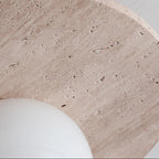 Travertine-style ceiling light canopy with speckled textured surface