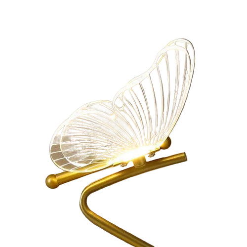 Close-up of gold butterfly lamp wings with lit LED core and curved metal frame