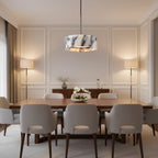 Marble drum pendant light with black cord and warm glow