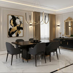 Black U-shaped wave chandelier hanging above dining table with ribbon arms