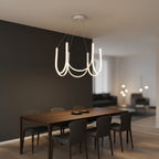 White U-shaped wave chandelier with ribbon arms and 6 candle-style bulbs