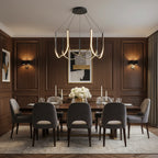 Black U-shaped wave chandelier with glowing candle-style bulbs and ribbon arms