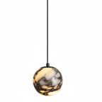 Marble glass orb pendant light with black cord and metal top