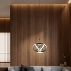 Twisted ribbon pendant light with black loop design and glowing white ring