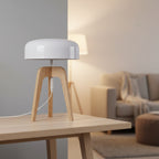 Tripod table lamp with white dome shade and light wood tripod legs