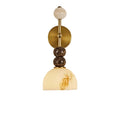 Gold-toned brass round backplate wall sconce with stacked stone spheres and dome shade
