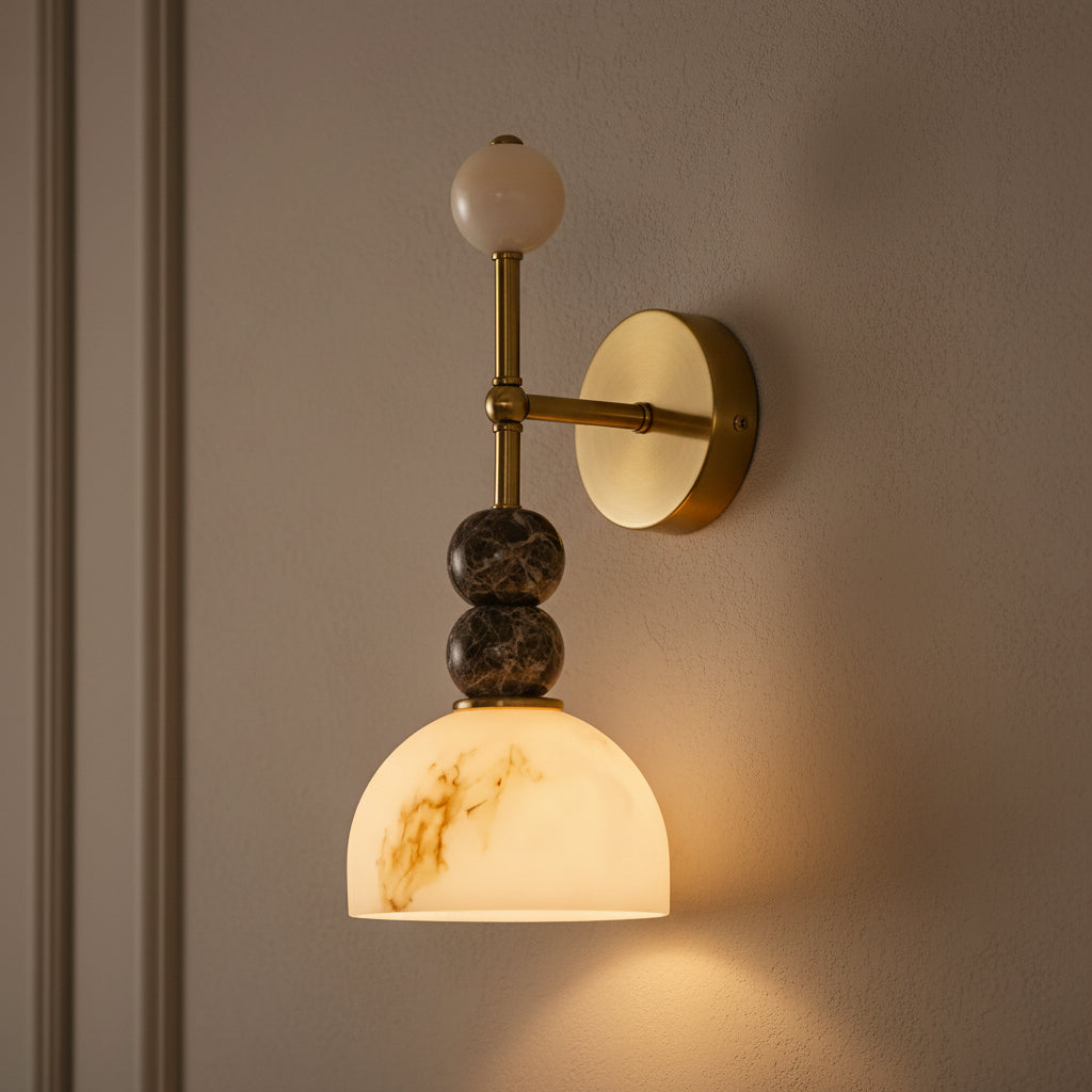 Brass dome arm wall sconce with stacked marble spheres and frosted dome shade