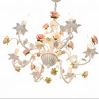 Floral arm chandelier with white curved arms, pink and green rose decorations