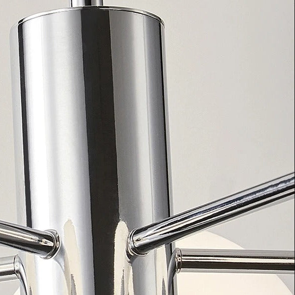Close-up of chrome vertical tube and metal arms for a globe chandelier